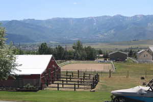 Property view of mountains with a rural view