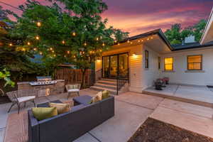 Cozy backyard with fireplace and grill