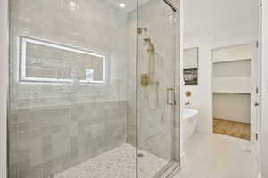 Primary bathroom with double sink vanity, spacious shower and soaker tub