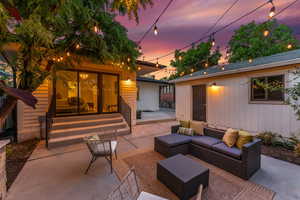 Cozy backyard with fireplace and grill