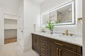 Primary bathroom with double sink vanity, spacious shower and soaker tub