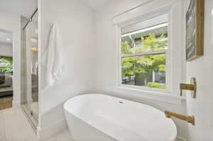 Primary bathroom with double sink vanity, spacious shower and soaker tub