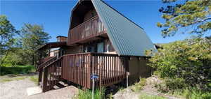 View of home's exterior with a deck