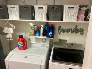 Washroom featuring washer and clothes dryer and washer hookup