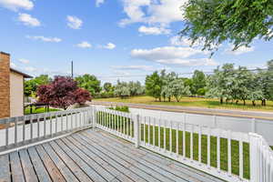 Deck featuring a yard