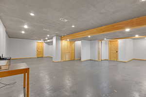 Basement with a textured ceiling