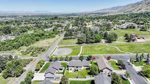 Birds eye view of property with a mountain view