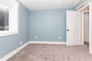 View of carpeted spare room