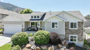 Craftsman-style home featuring a garage and a mountain view