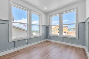 Unfurnished room with light wood-type flooring