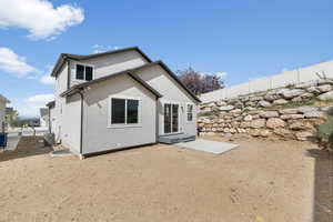 Back of house featuring cooling unit