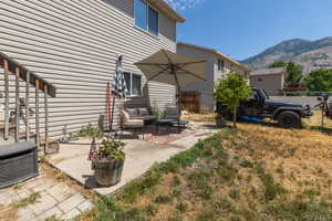 Exterior space featuring a patio area and a mountain view