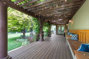 Trex deck with vine covered gateway leading to dinette entrance