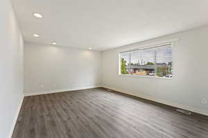 Empty room featuring hardwood / wood-style flooring