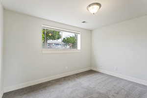 Unfurnished room featuring carpet