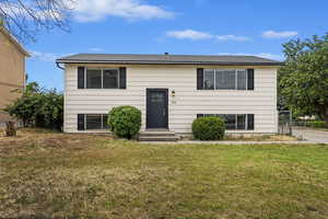 Split foyer home featuring a front yard