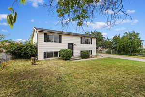 Split foyer home with a front yard