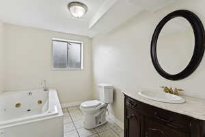 Bathroom featuring vanity, toilet, and tile floors