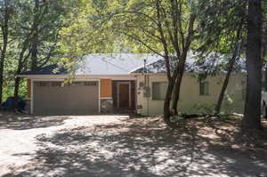 Ranch-style house featuring a garage