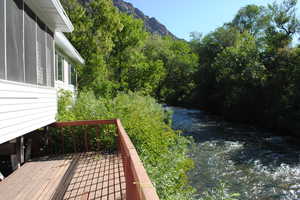 Wooden deck featuring a water view