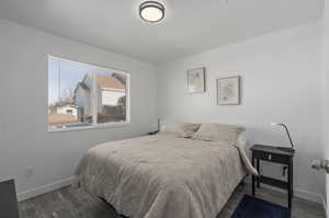 Bedroom featuring dark hardwood / wood-style floors