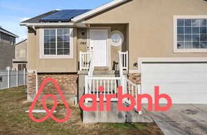 Exterior space featuring a garage and solar panels