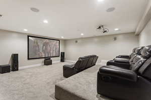 Cinema room with carpet flooring