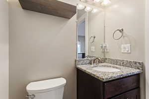 Bathroom featuring vanity and toilet