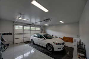 Garage featuring a garage door opener