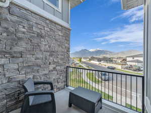 Balcony with a residential view and a mountain view
