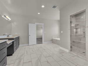 Primary Bedroom Full bath featuring visible vents, a stall shower, vanity, baseboards, and marble finish floor