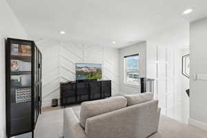 Living room featuring light colored carpet