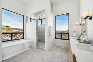 Bathroom with vanity and independent shower and bath