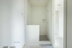 Bathroom featuring tiled shower