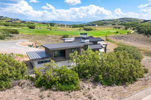 Birds eye view of property with a mountain view