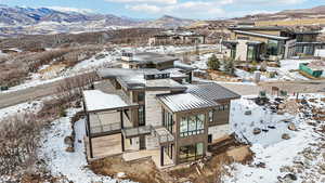 Snowy aerial view with a mountain view