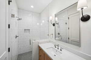 Bathroom featuring vanity and walk in shower