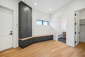 Mudroom with light hardwood / wood-style flooring