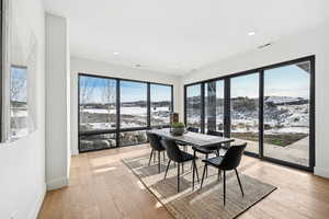 Dining space with light wood-type flooring