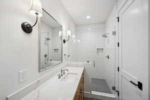 Bathroom featuring vanity and walk in shower