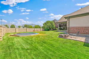 View of yard with a mountain view and a patio area