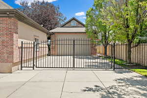 View of gate featuring the RV garage and storage area above