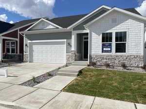 Craftsman inspired home with a front yard and and extended 2 garage