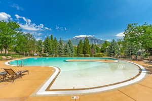 View of swimming pool with large deck