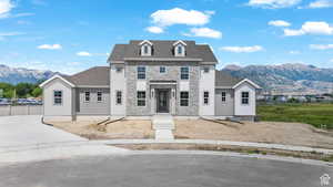 View of front of property with a mountain view