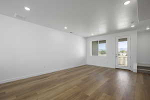 Unfurnished room featuring hardwood / wood-style floors