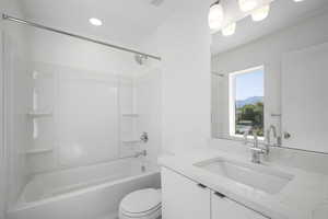 Full bathroom featuring shower / washtub combination, toilet, and vanity