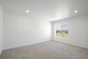 Unfurnished room featuring carpet