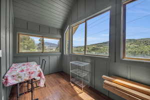 Sunroom / solarium with vaulted ceiling