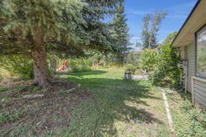 View of yard featuring a playground